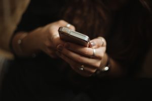 Woman Playing Mobile Online Games in a Remote Quiet Place